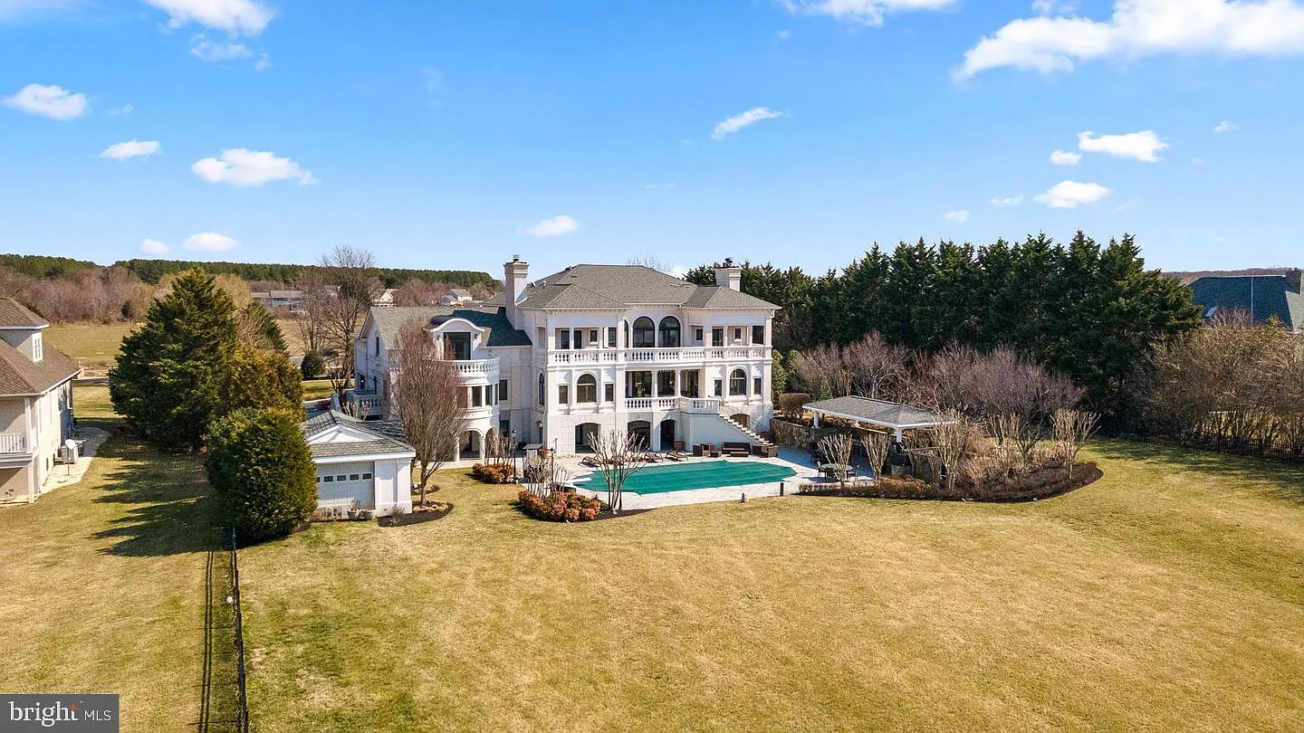 319 Blue Bay Road, Stevensville MD 21666 — luxury waterfront estate in the Wolf Farm community on Kent Island, with neoclassical Monticello-inspired architecture and unobstructed views of the Chesapeake Bay