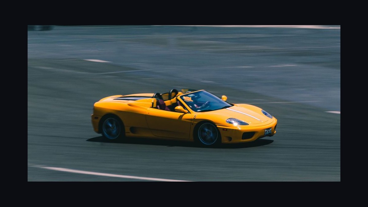 What's the difference between a grand tourer and a sports car when choosing one to drive across states in 2027 — figure 9