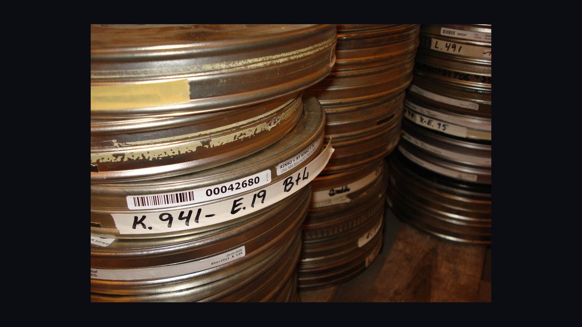 How do film preservationists restore and archive deteriorating nitrate film prints in 2027?