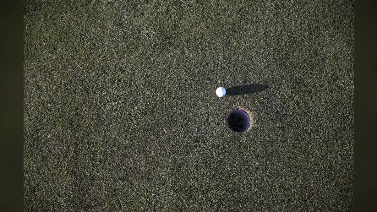 Should I open a 9-hole or 18-hole mini-golf course in a tourist town, and what's the throughput math — figure 1
