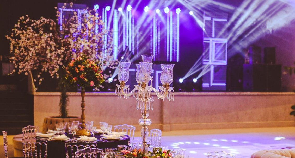 What's the right per-event price for a 4-hour photo booth rental, and what add-ons drive the highest margin in 2027?