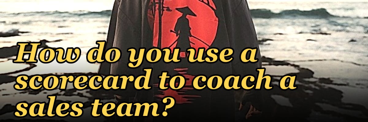 How do you use a scorecard to coach a sales team?