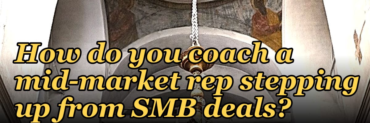How do you coach a mid-market rep stepping up from SMB deals?