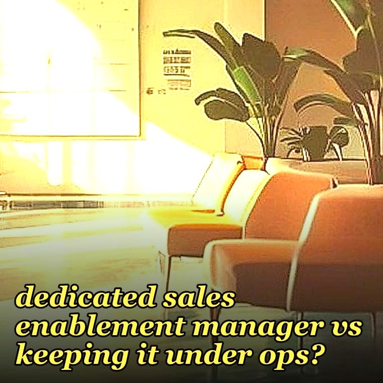 When should we hire a dedicated sales enablement manager vs keeping it under ops?