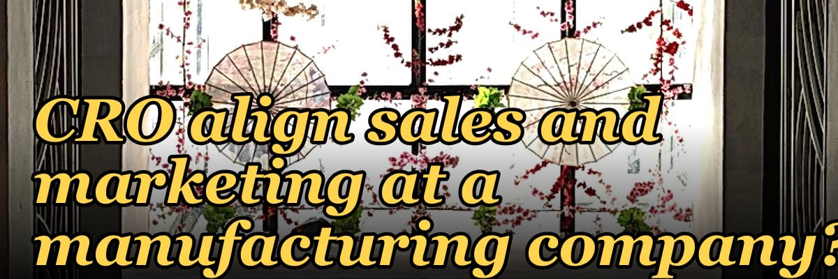 How does a fractional CRO align sales and marketing at a manufacturing company?